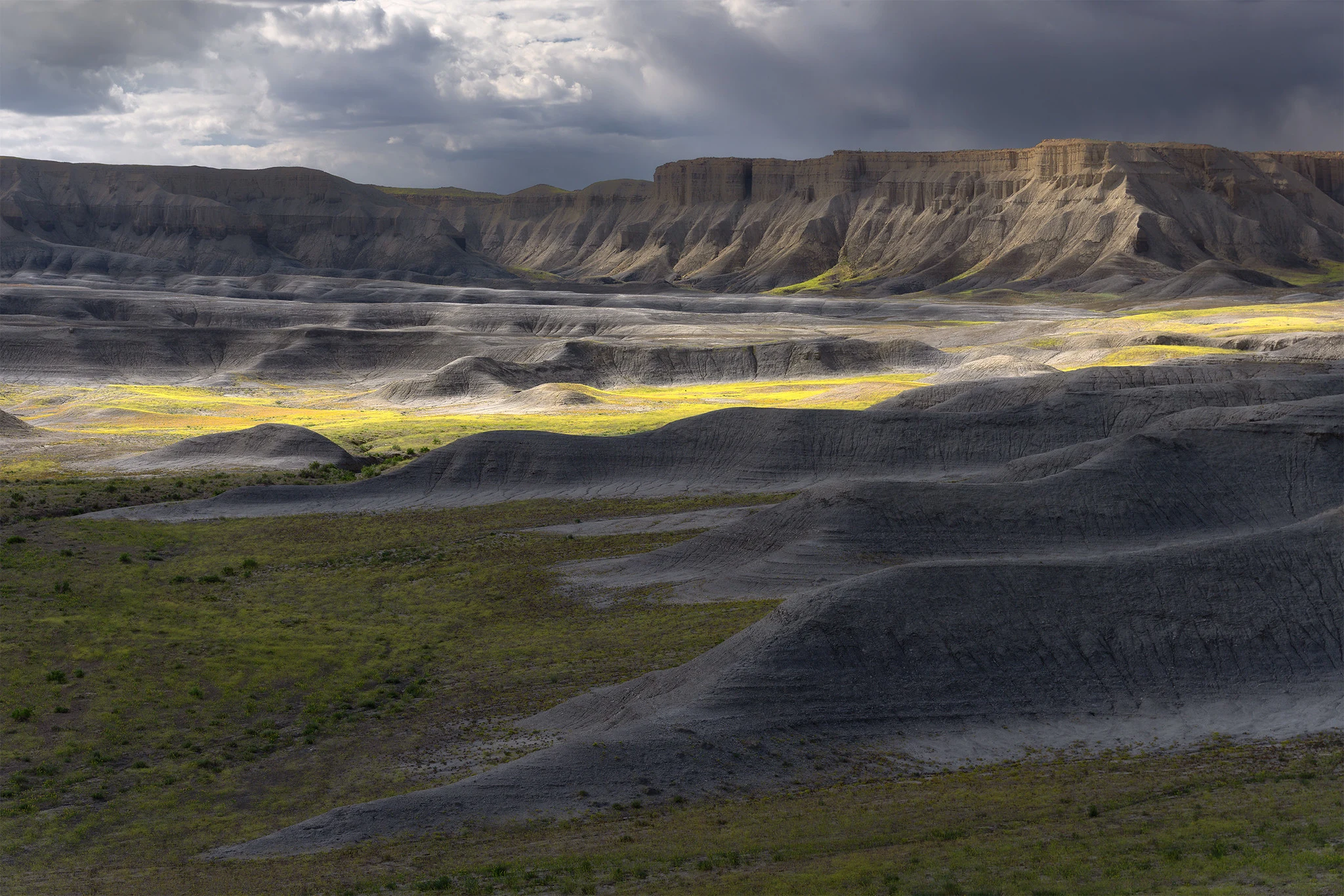 Spring light crossing the colorful badlands of Southern Utah
