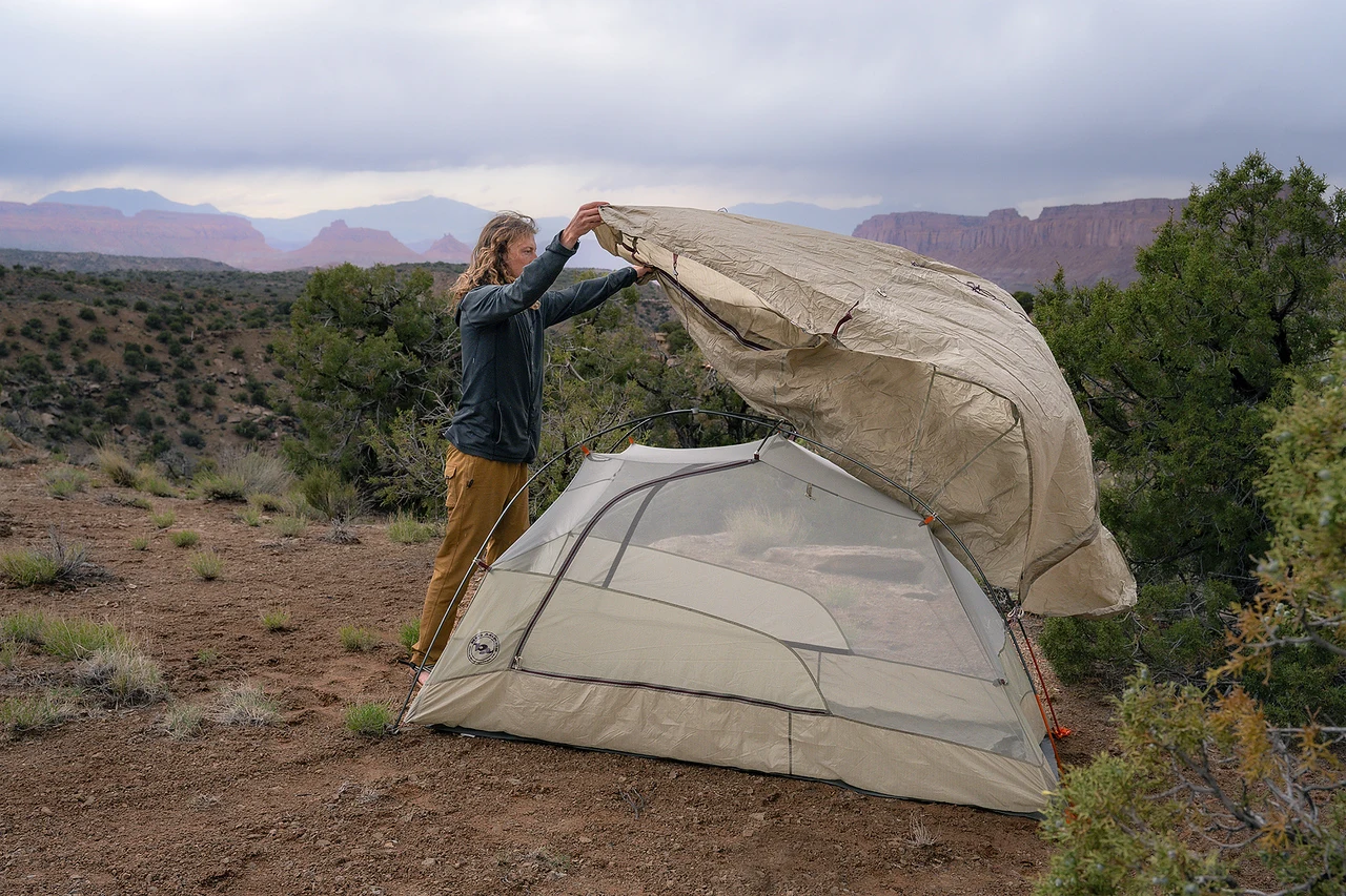 Setting up a tent at a remote Southern Utah wilderness camp