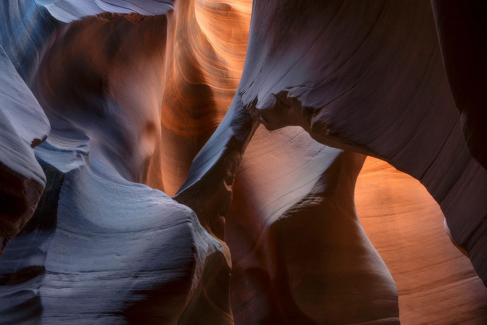 Warm reflected light moving through a remote Utah slot canyon