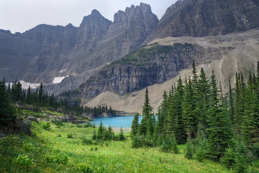 A mountain lake beneath rugged peaks.