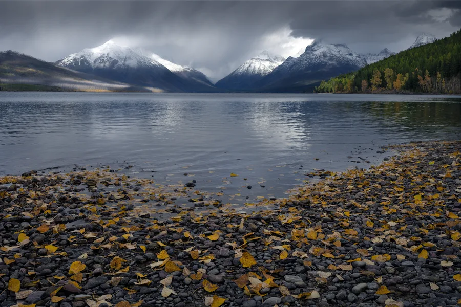 A mountain lake beneath cloud-filled skies.