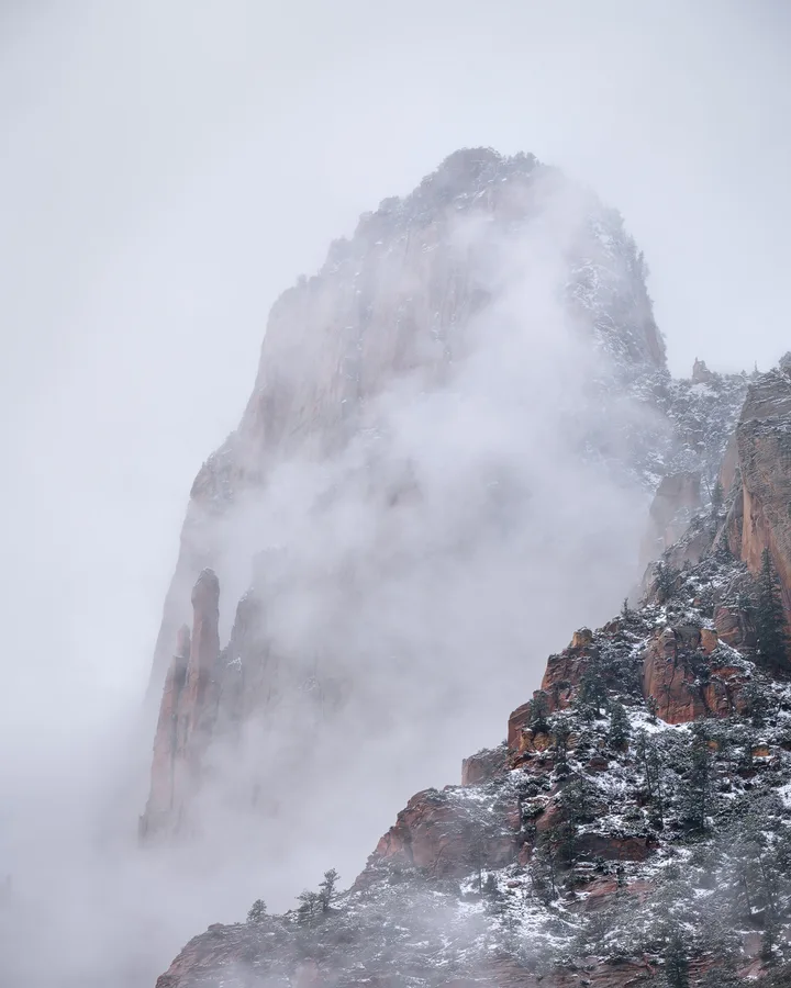 Snow-covered mountains rise beneath an open sky.
