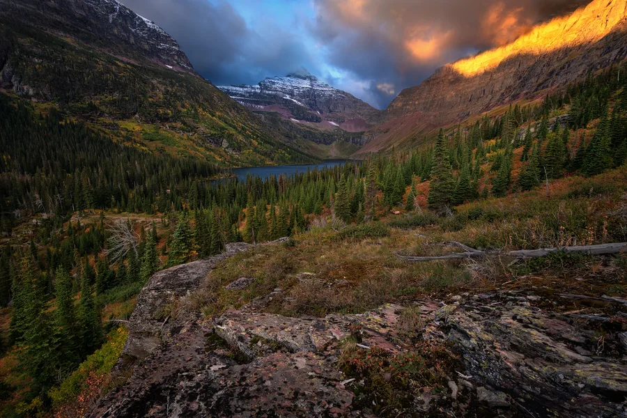 A mountain lake beneath cloud-filled skies.
