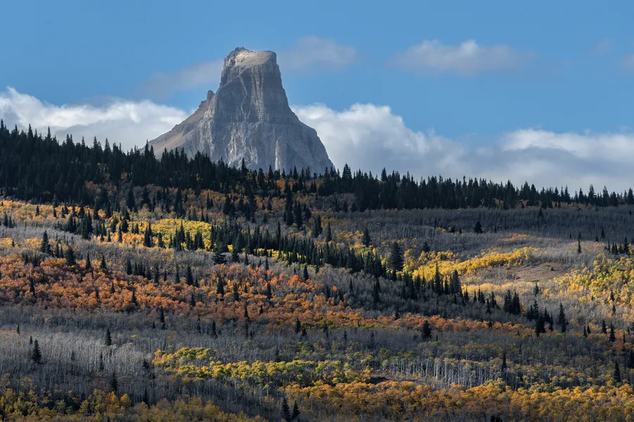 Rugged mountains rise beneath a cloudy sky.