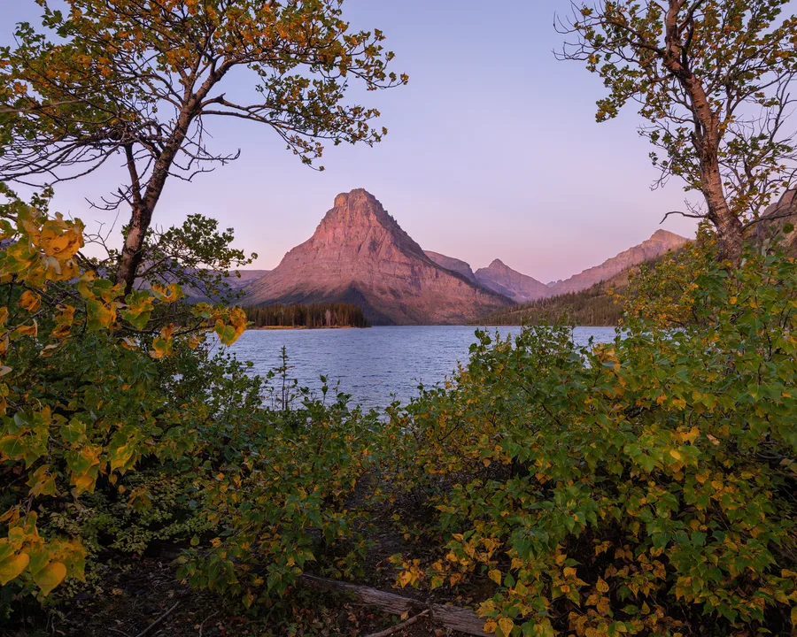 A mountain lake beneath rugged peaks.