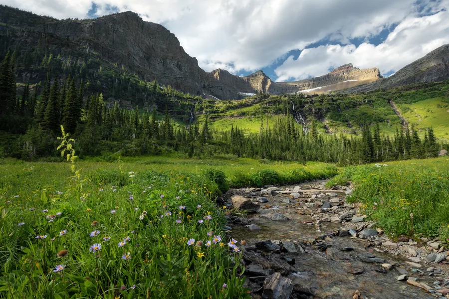 A creek flows through a mountain landscape.