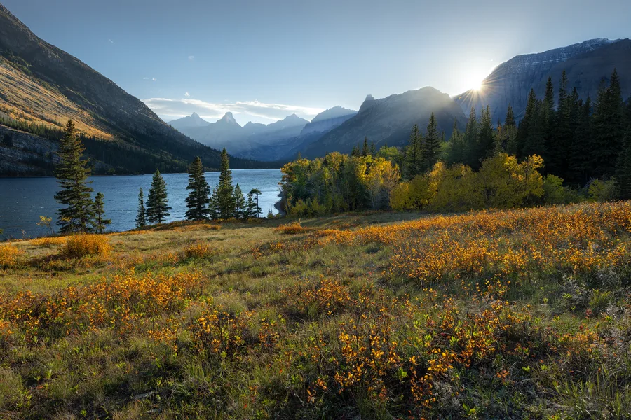 A mountain lake beneath cloud-filled skies.